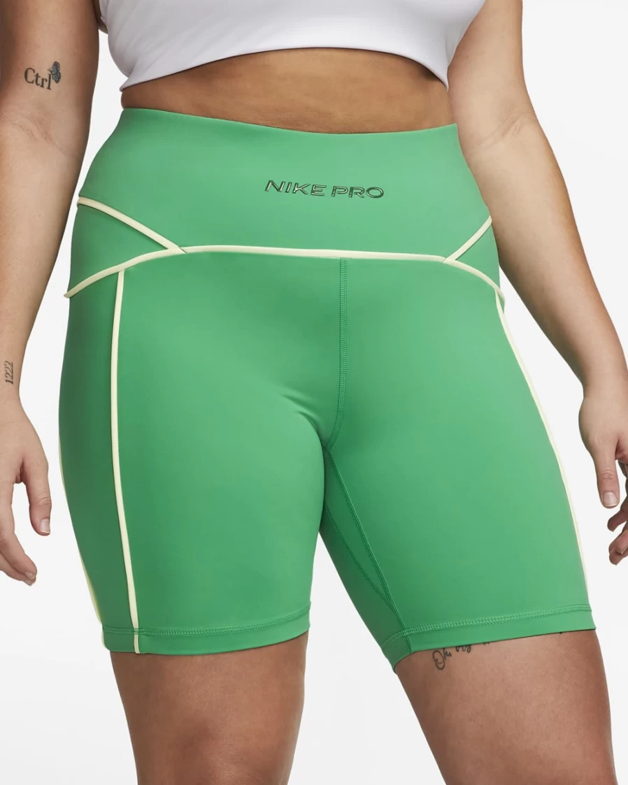 Nike Pro Women's Mid-Rise 7" Biker Shorts - Plus Size in Stadium Green/Barely Volt/Gorge Green